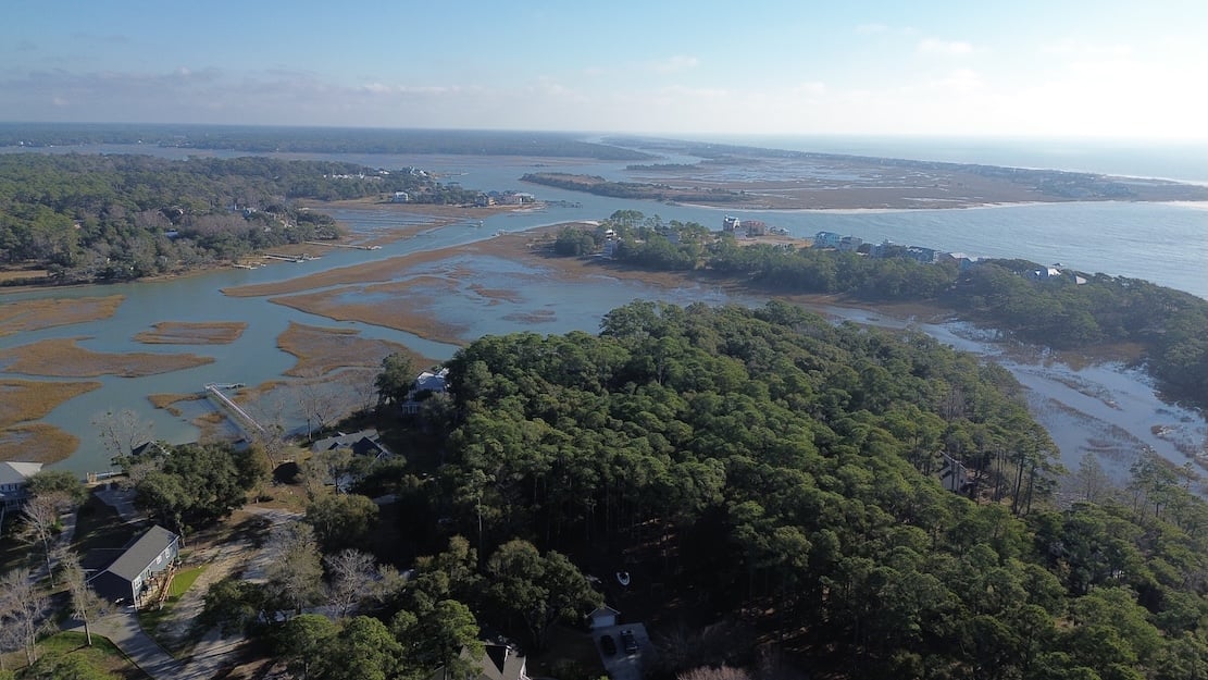 Aerial view of coastal North Carolina waterways, marshes, and homes.